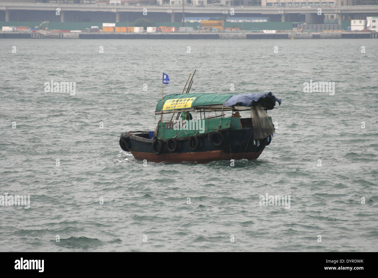 small boat in the harbor of Hong Kong Stock Photo