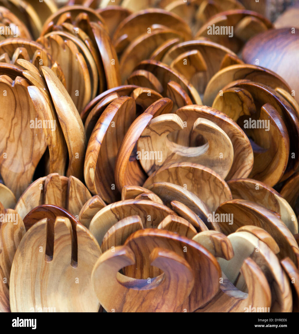 Salad spoons and forks made of olive wood on sale as tourist mementoes in Greece Stock Photo