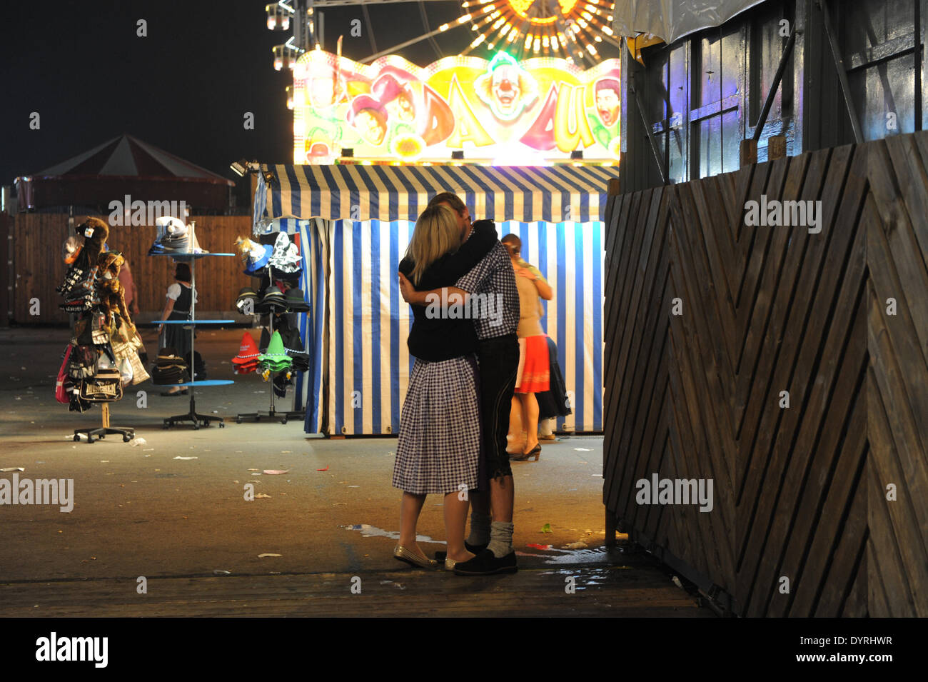 Couple kissing late at night at the oktoberfest hi-res stock ...