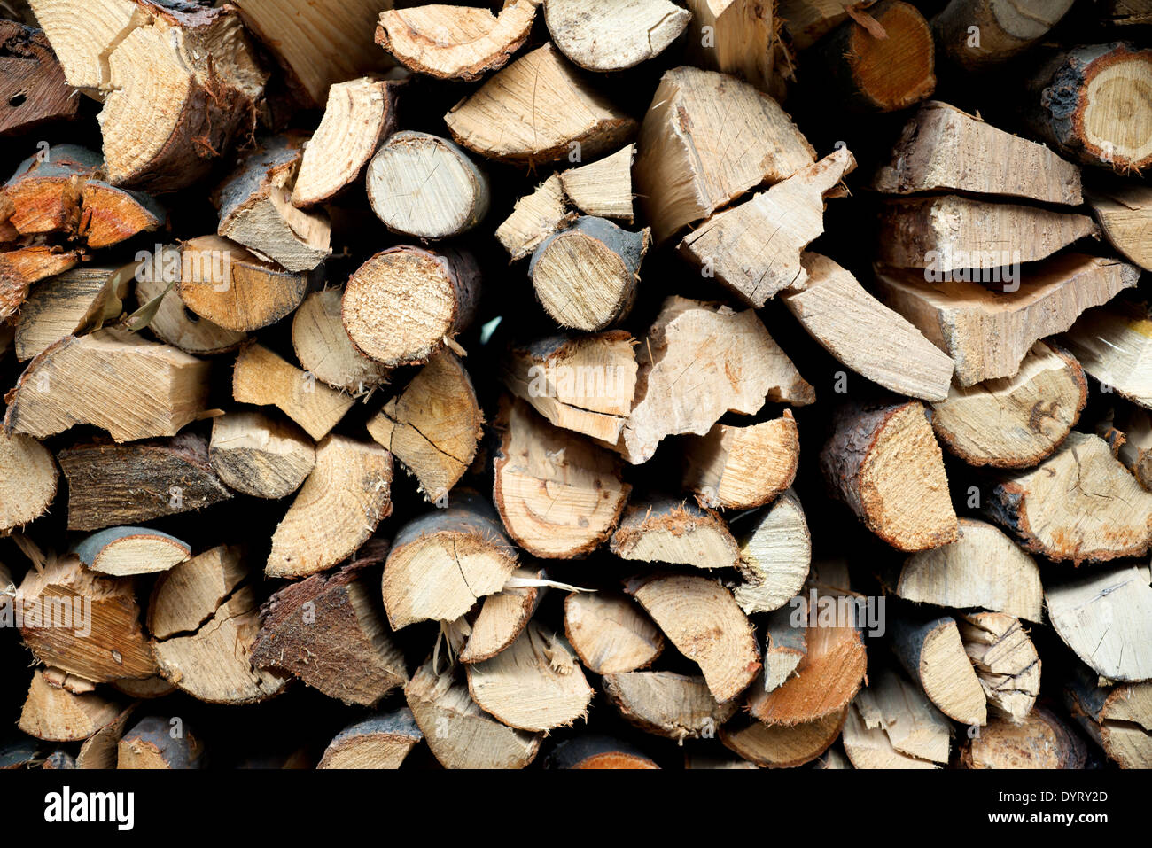 A pile of hard fire wood fence background Stock Photo