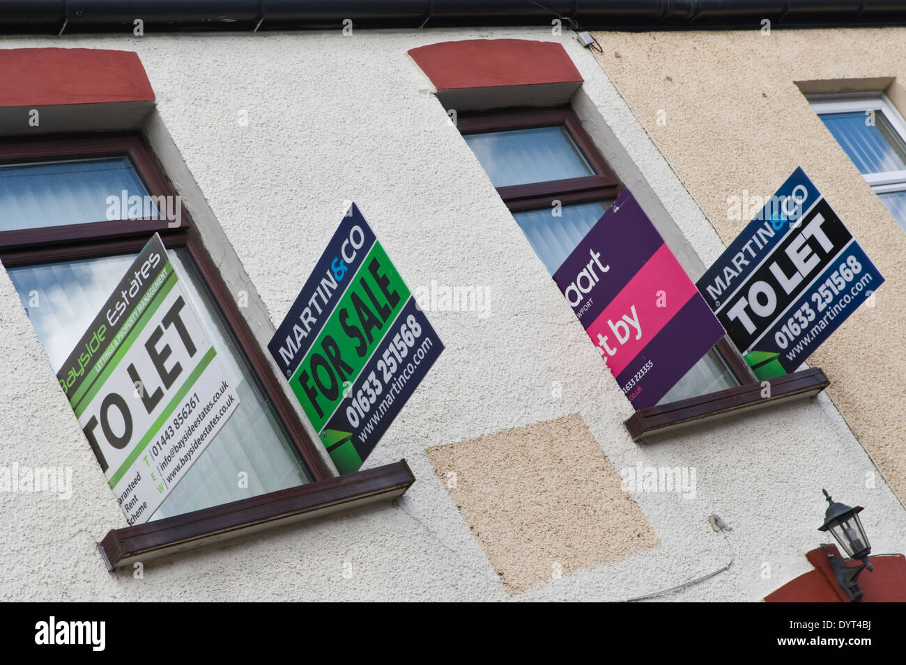 For sale and to let signs on end of terrace house Newport South Wales