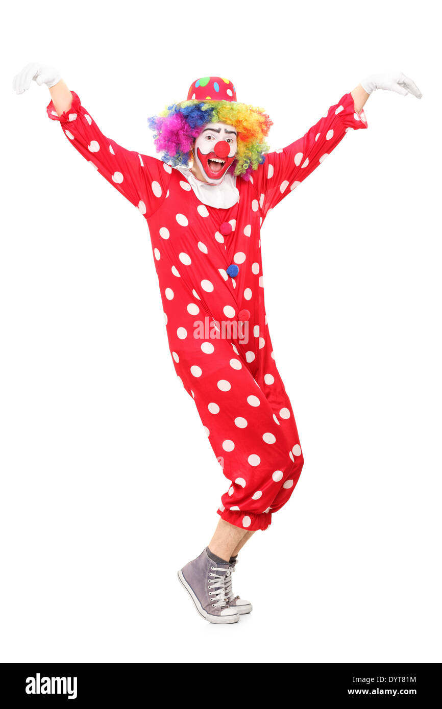 Full length portrait of a happy male clown dancing Stock Photo