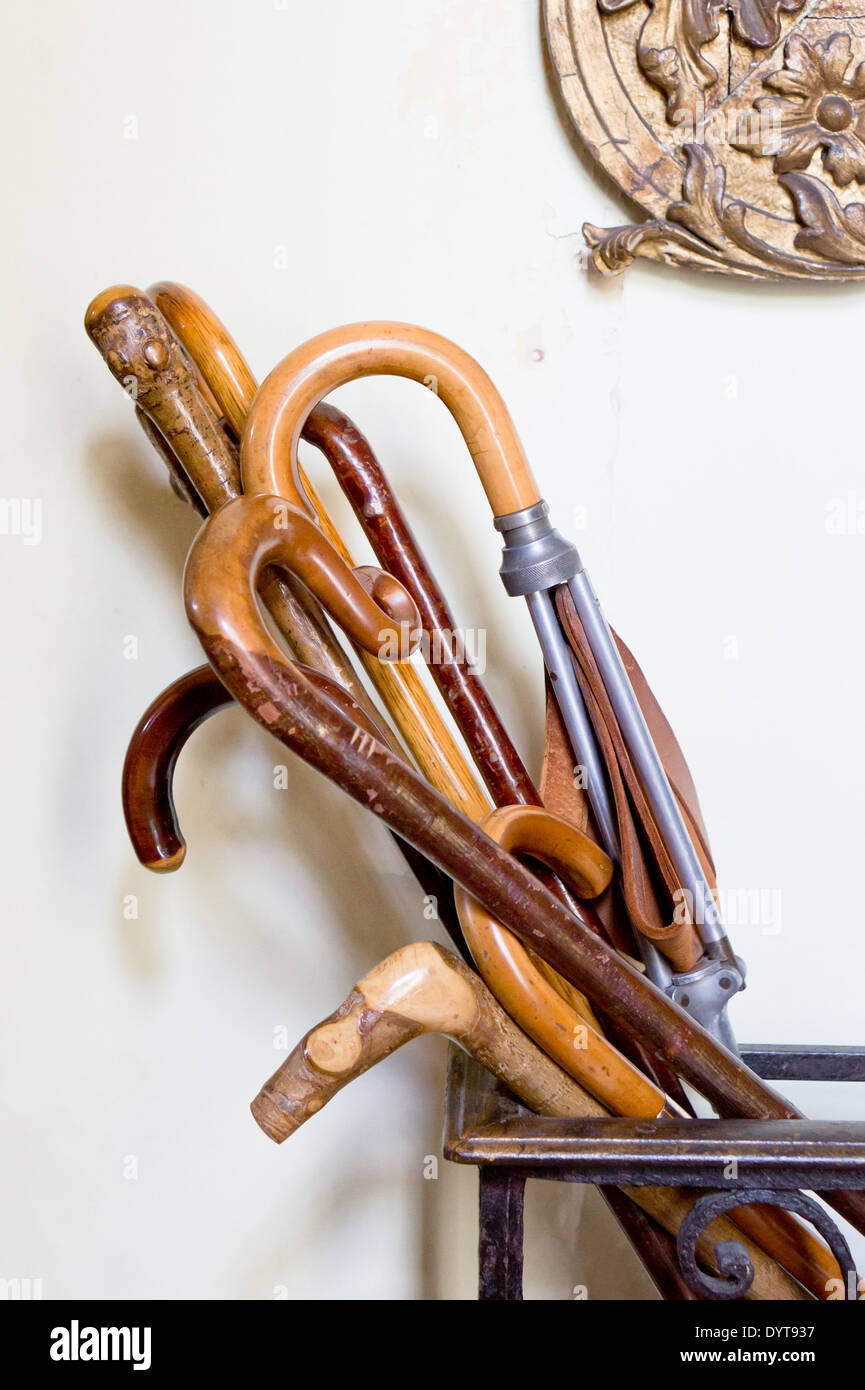 Collection of antique walking canes in a house Stock Photo