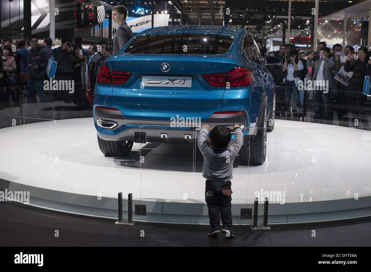 Visitors look at a BMW Concept X4 car at Auto Shanghai 2013 Stock Photo