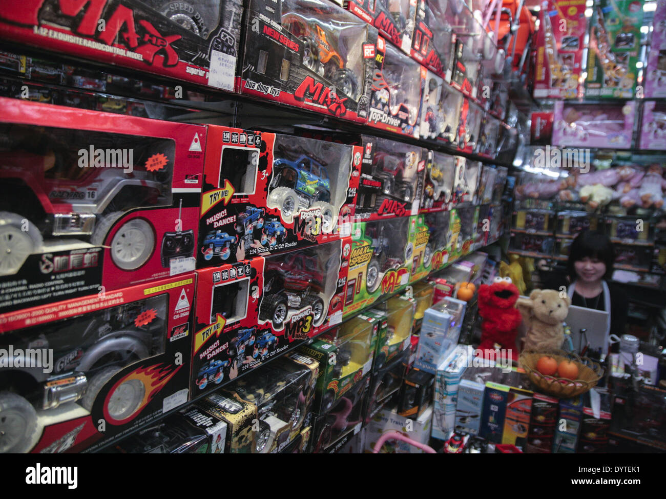 A shop clerk sit in her toy store at small commodities wholesales market at Yiwu city Stock Photo