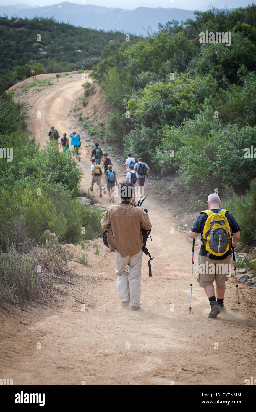 Hikers going downhill at the El Cajon mountain trail, in April 2013. Stock Photo