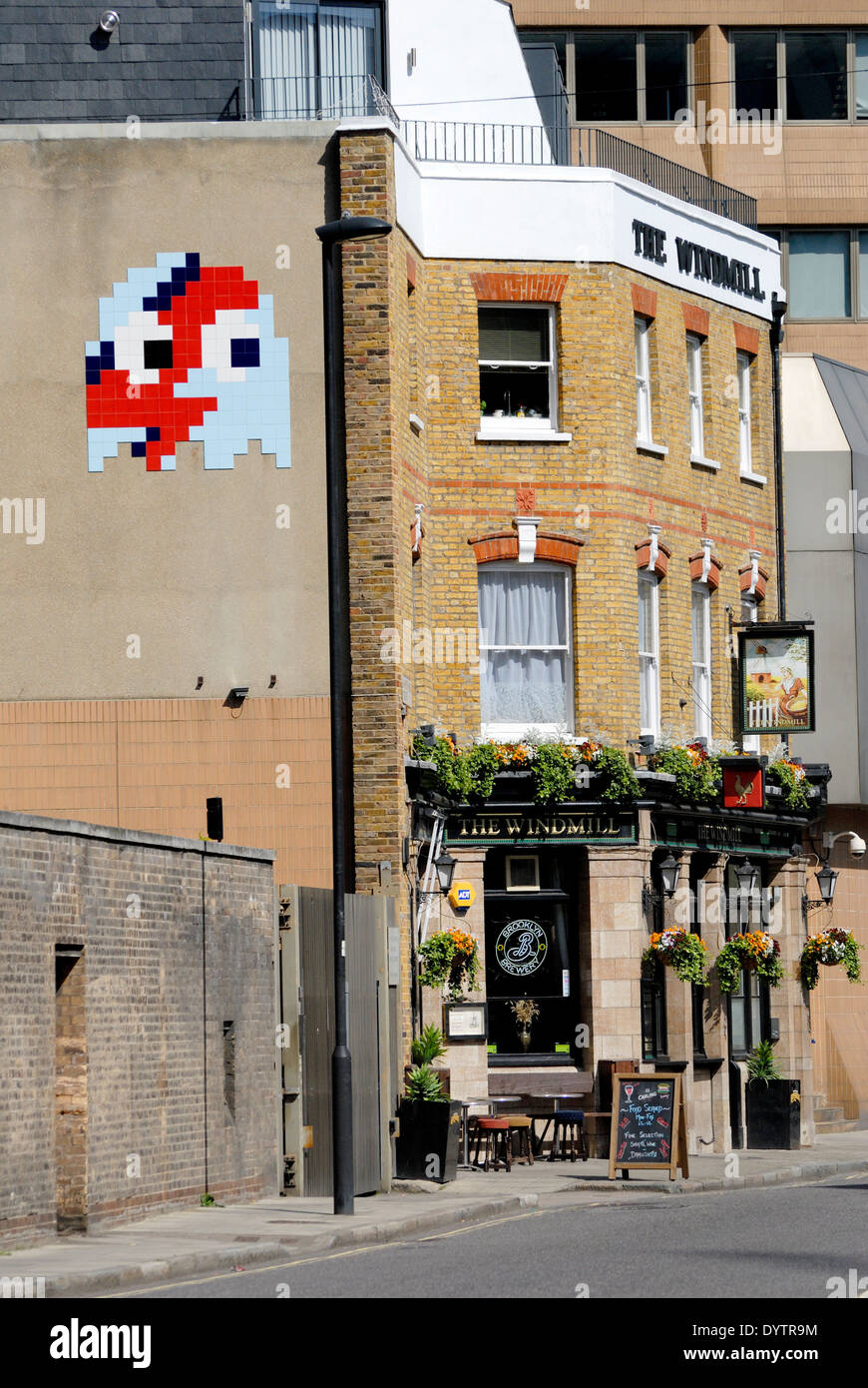 London, England, UK. Space invader tiled street art by 'Invader' (French urban artist) in Lambeth, Windmill pub Stock Photo