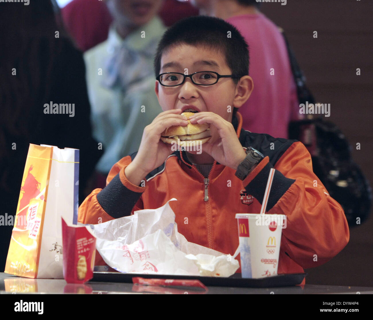 A kid eat in a Mcdonalds restaurant Stock Photo