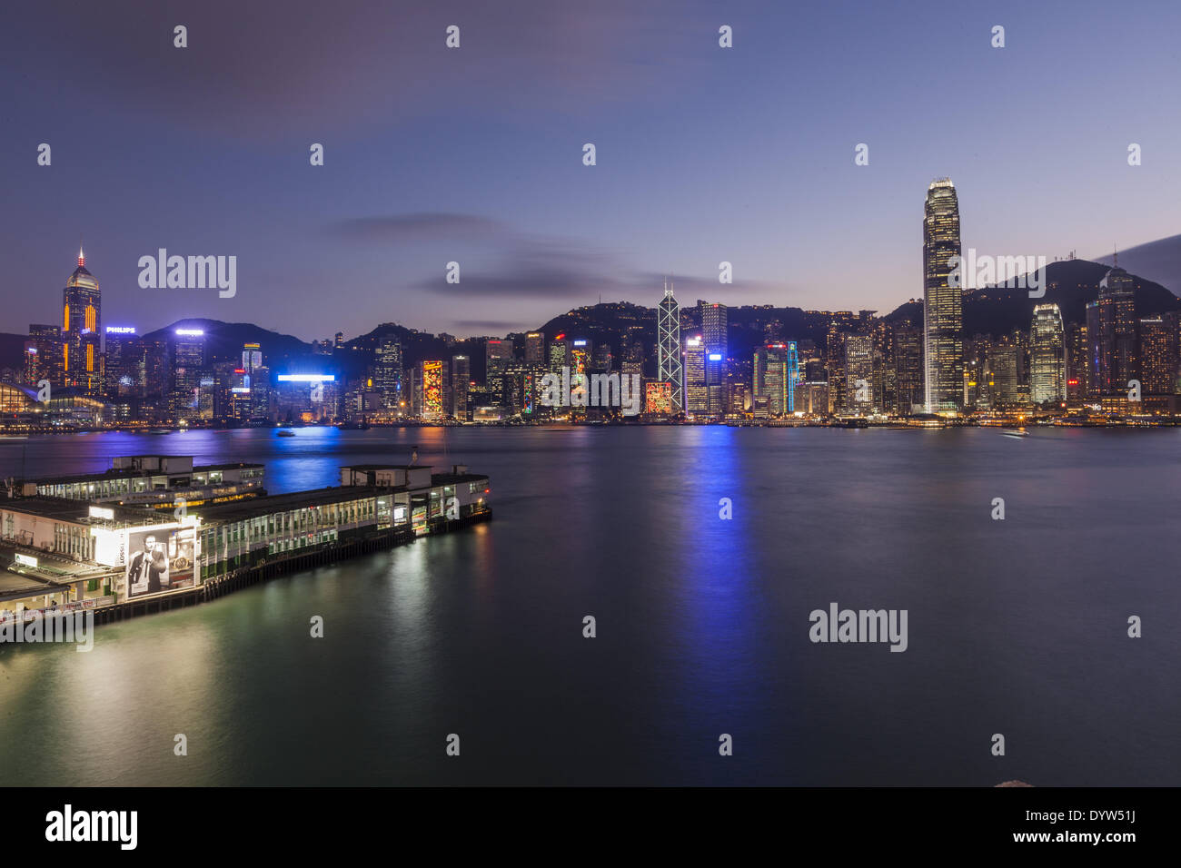 Vessels sail at Victoria Harbour at night Stock Photo - Alamy