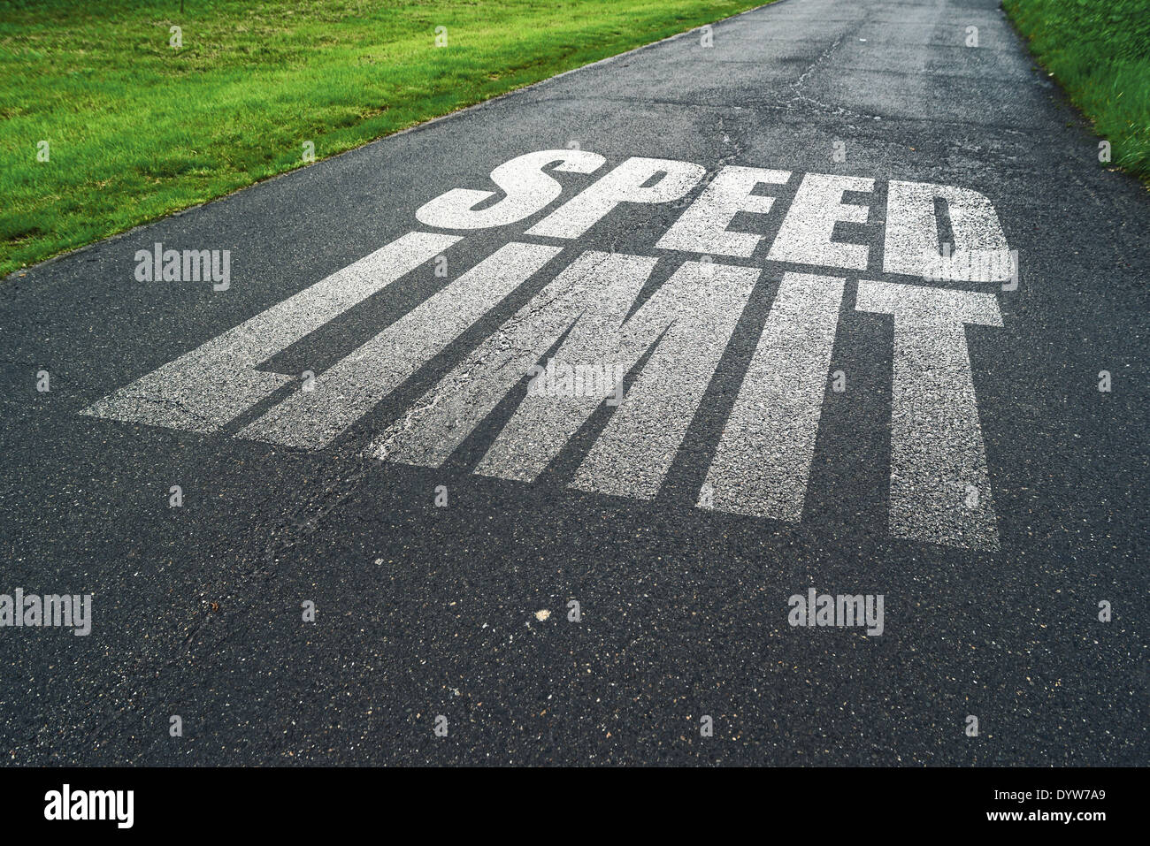 Speed Limit message reminder on asphalt road. Concept of safe driving and preventing traffic accident. Stock Photo