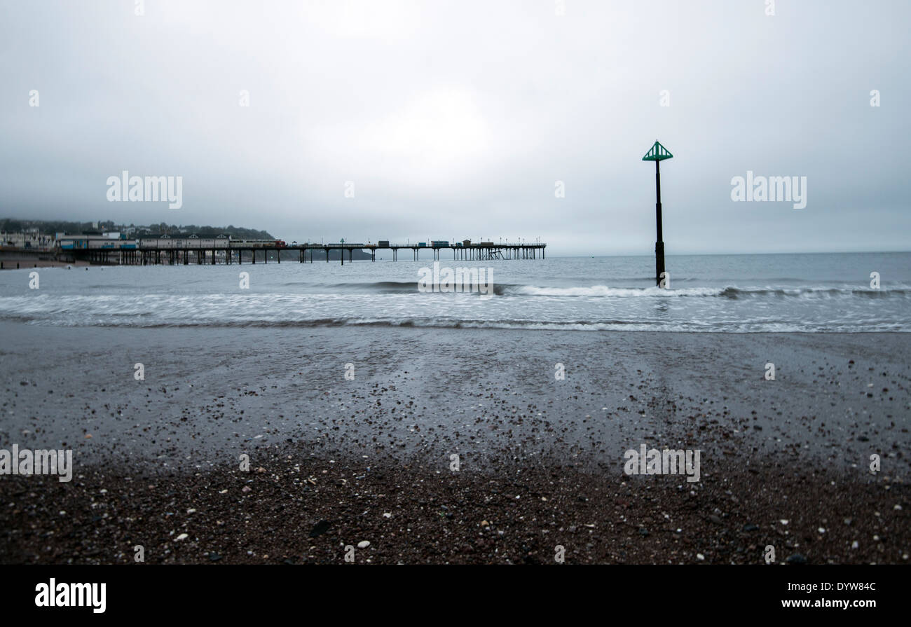 A grey start to the day on the beach at Teignmouth, Devon England UK