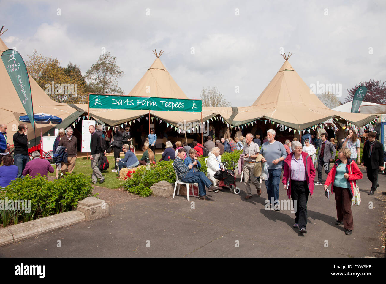 Exeter, UK. 25th April, 2014. The Exeter Festival of Southwest  Food and Drink Fair, three day festival of local produce and cooking. Festival visitors enjoy spring weather by the Darts Farm tent Credit:  Anthony Collins/Alamy Live News Stock Photo