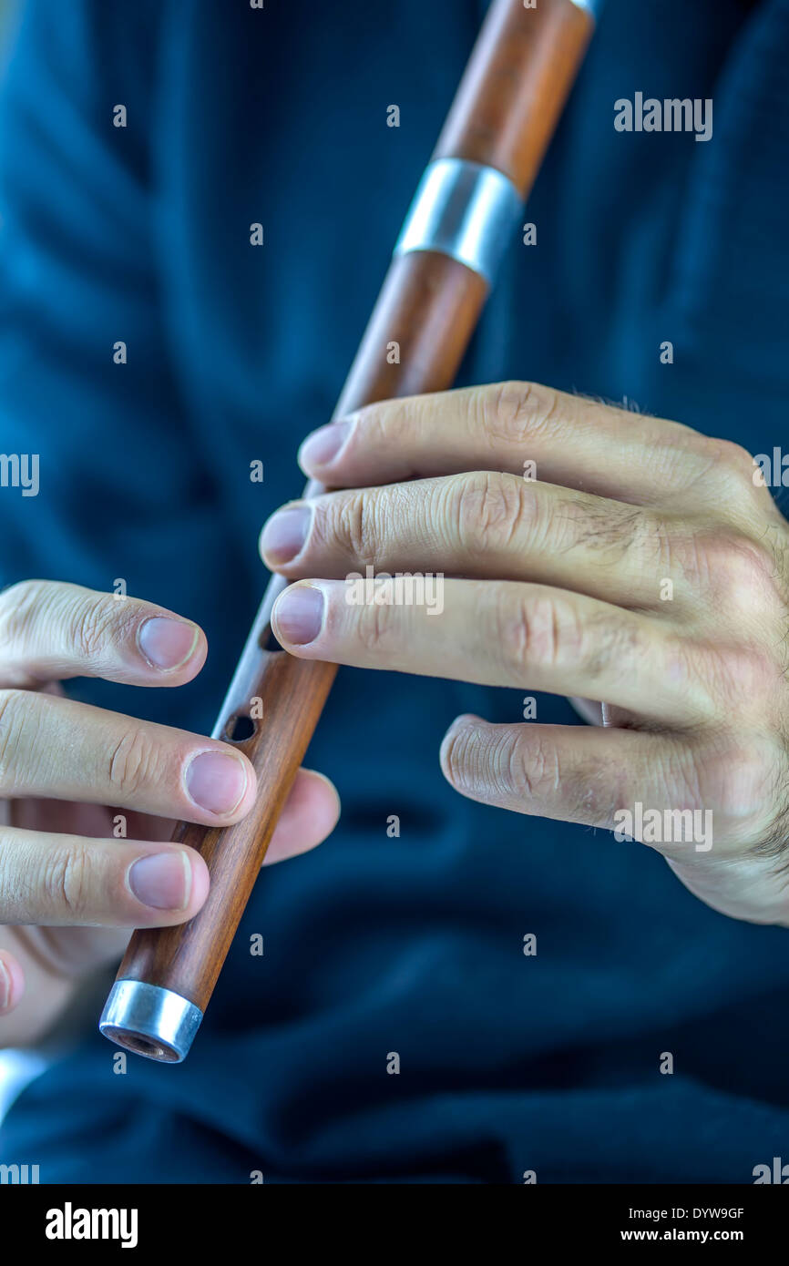 Wooden flute player Stock Photo Alamy