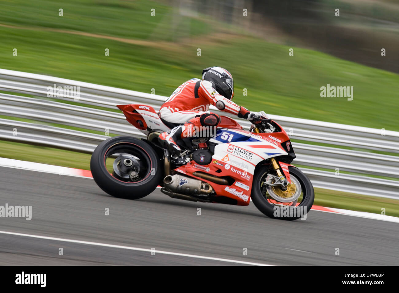 british superbike speeding around Oulton park race circuit during a practice day on the 25/04/2014 Stock Photo