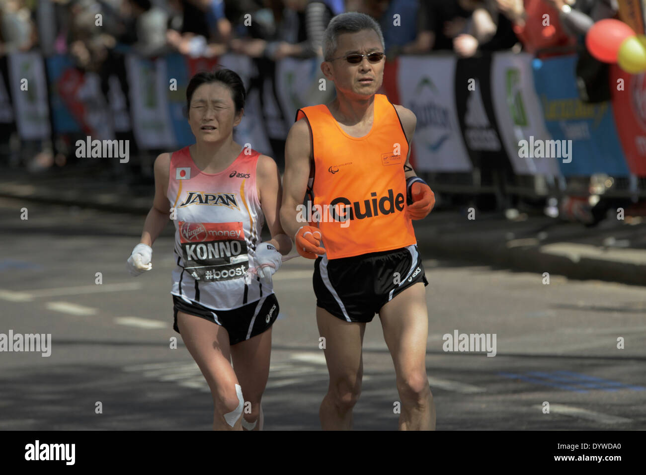 Disabled athlete with a guide at London Marathon Stock Photo