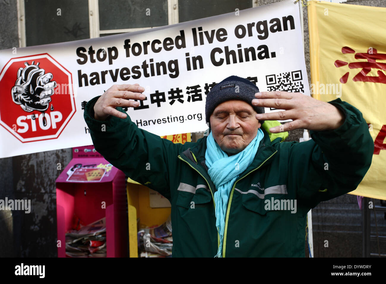 A man practicing Falun Gong during the protest against persecution of Falun Gong followers in China Stock Photo