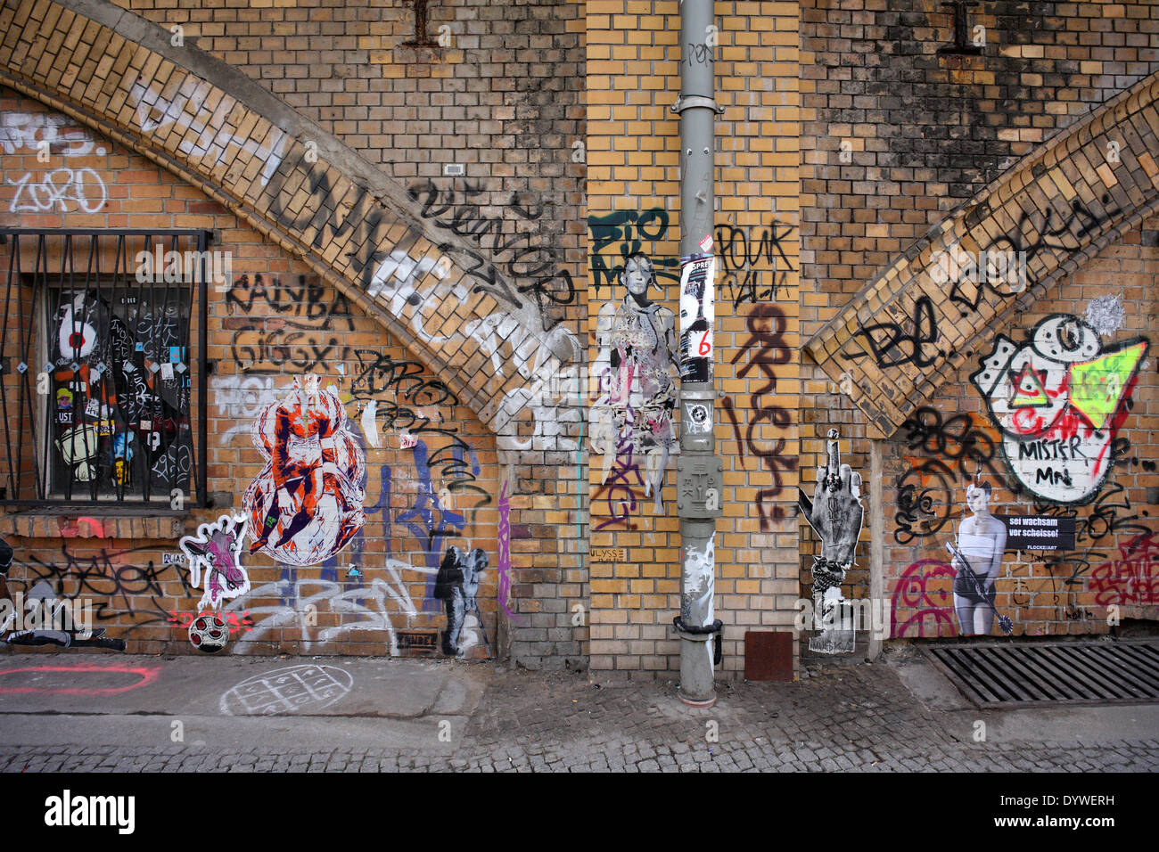 Berlin, Germany, graffiti and paste -up on the facade of the S- Bahnboegen Stock Photo
