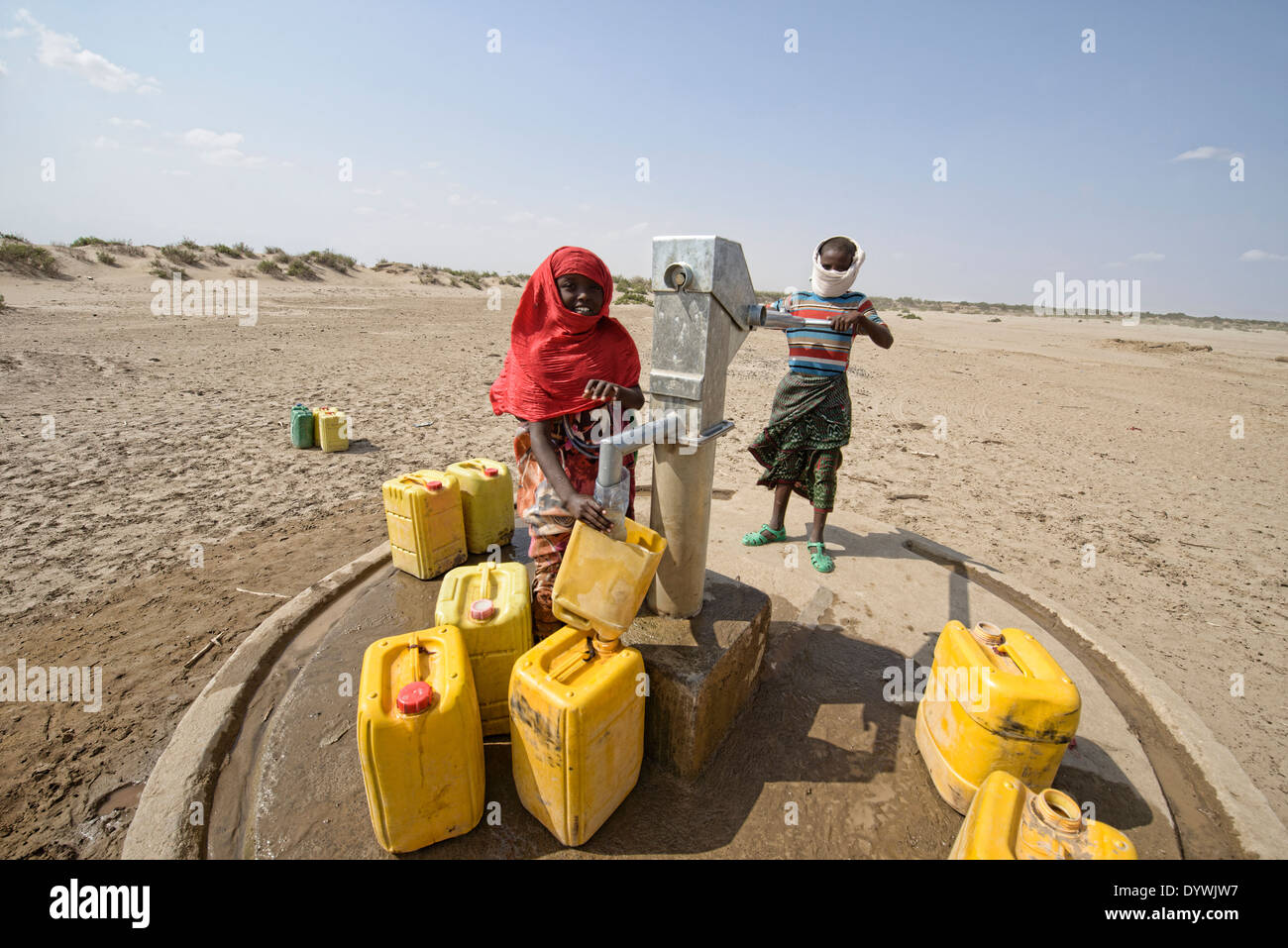 Afar kids at a desert water pump in the Danakil Depression, Ethiopia