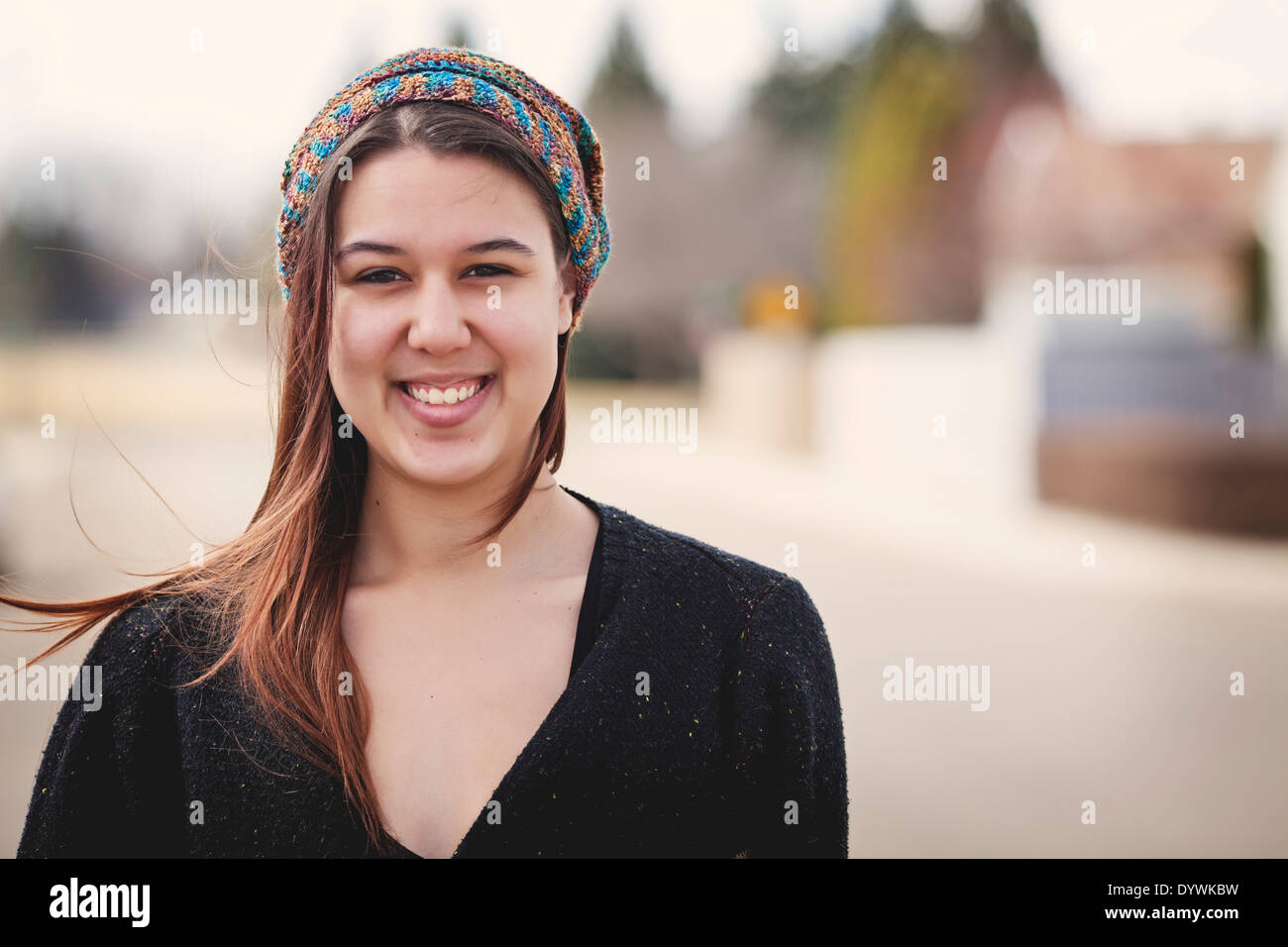 Portrait of a twenty-four year old woman on the street wearing a slouch ...