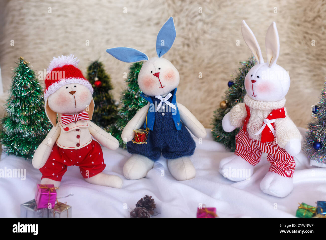 Christmas toy rabbits on the background trees Stock Photo Alamy