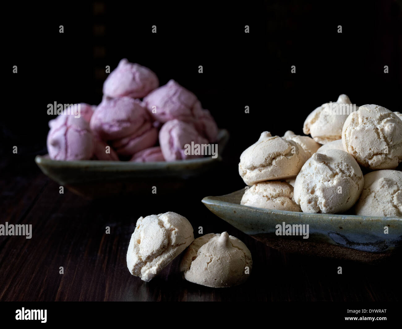 Meringue cookies in raspberry and coffee flavor Stock Photo
