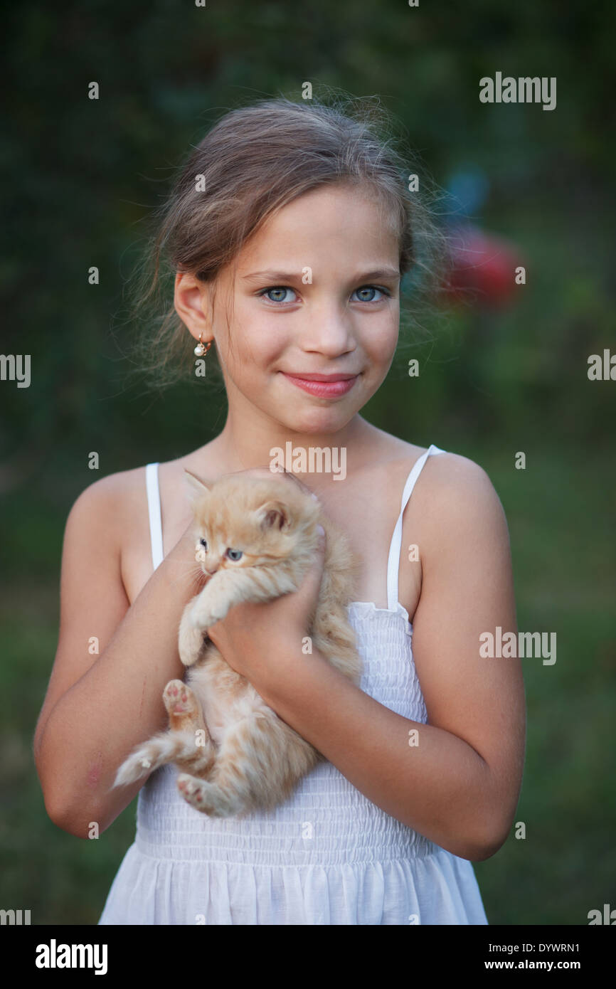 Lovely girl with cute kitten Stock Photo