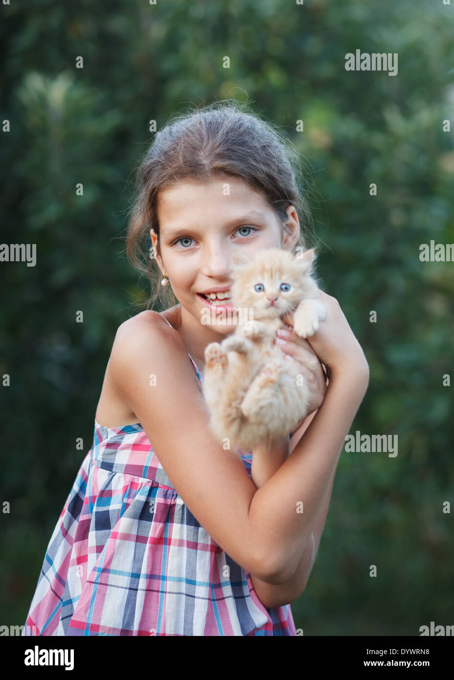 Lovely girl with cute kitten Stock Photo