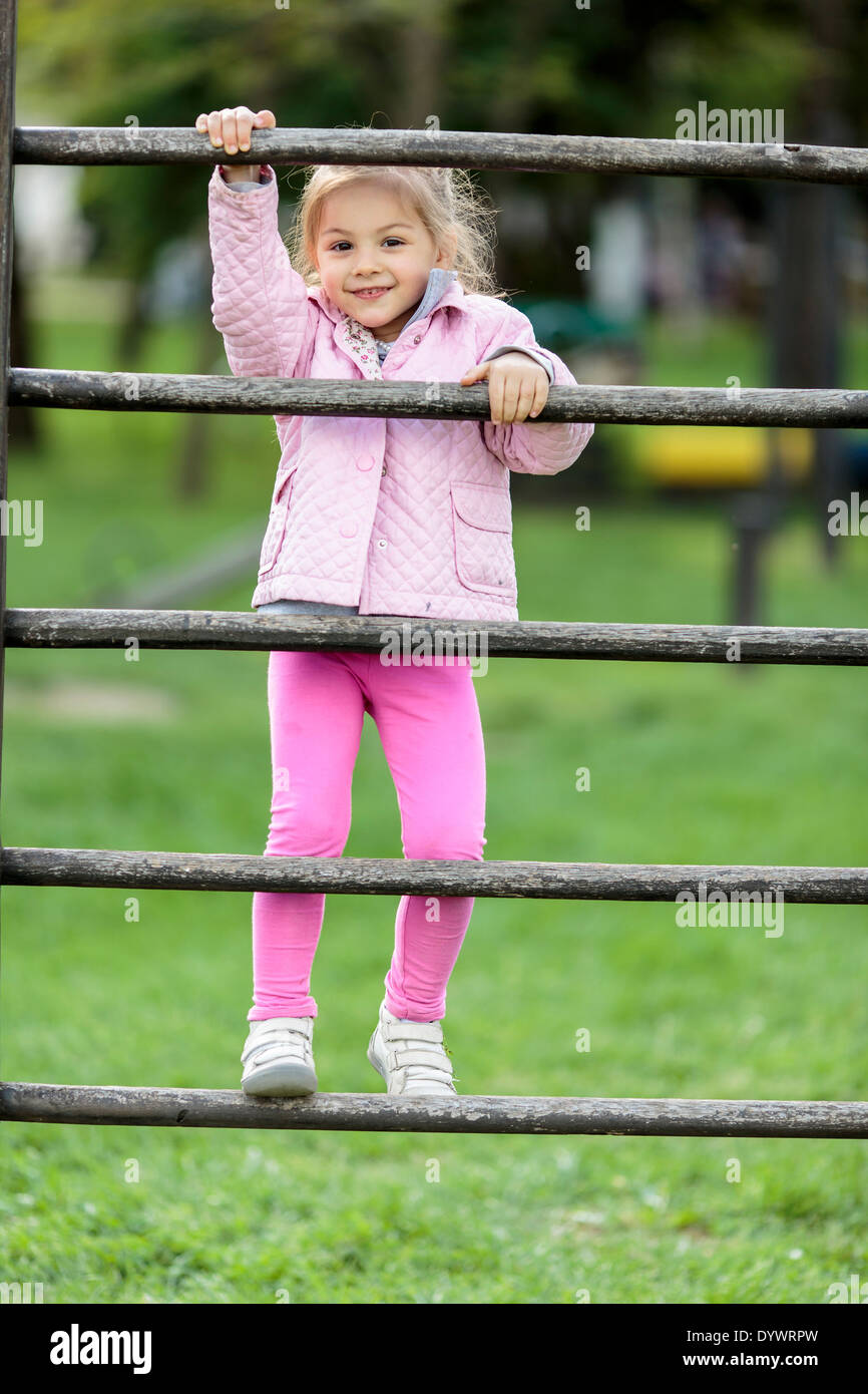 Cute little girl playing in the park Stock Photo - Alamy