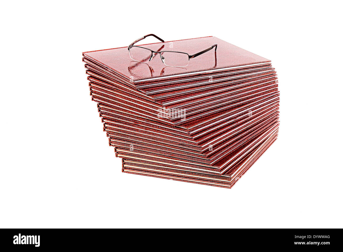 Pile of books and glasses on white background Stock Photo
