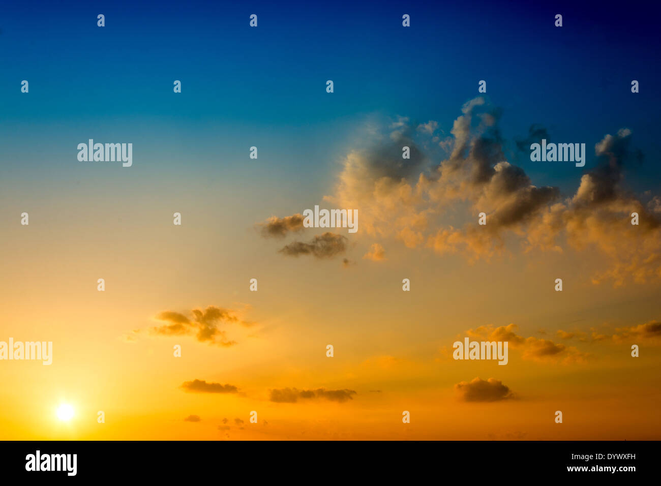 Beautiful and idyllic sunset and fluffy clouds Stock Photo - Alamy