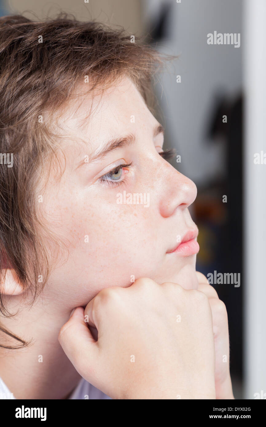 unhappy sad boy, face close up stressed child Stock Photo