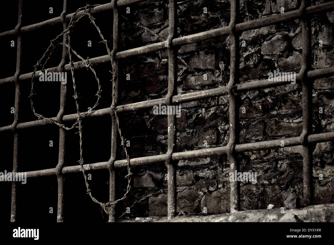 Burned up prison cell with barbed wire Stock Photo