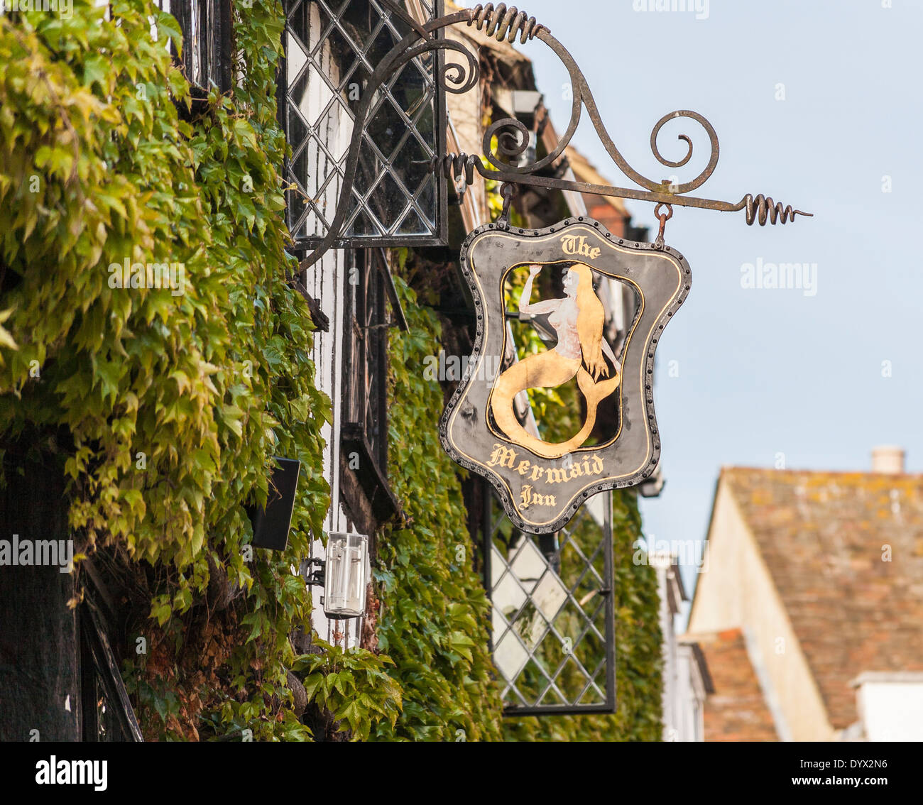 Sign of the Mermaid Inn in Rye, East Sussex, UK, outside ivy-clad wall Stock Photo