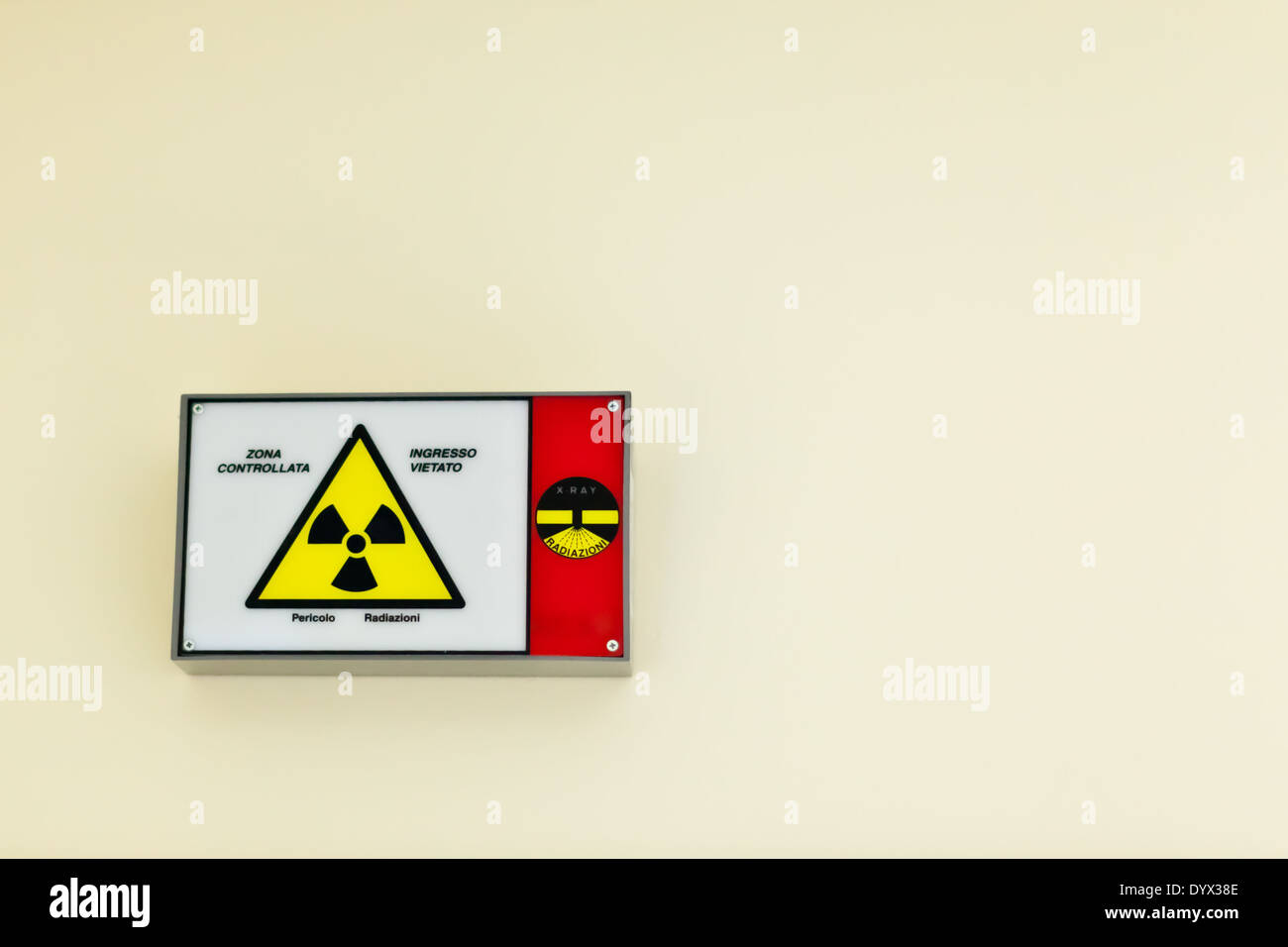 Radioactive sign on a wall Stock Photo