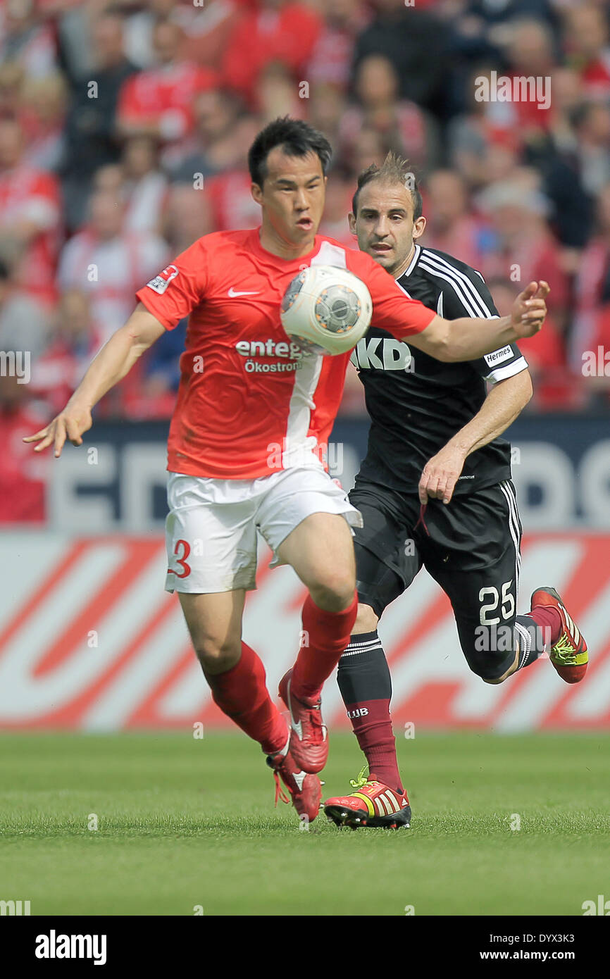 Mainz, Germany. 26th Apr, 2014. Mainz' Shinji Okazaki (L) and Nuremberg's Javier Pinola (R) vie for the ball during the German soccer Bundesliga match between 1. FSV Mainz 05 and 1. FC Nuremberg at the Coface Arena in Mainz, Germany, 26 April 2014. Photo: FREDRIK VON ERICHSEN/dpa (ATTENTION: Due to the accreditation guidelines, the DFL only permits the publication and utilisation of up to 15 pictures per match on the internet and in online media during the match.)/dpa/Alamy Live News Stock Photo