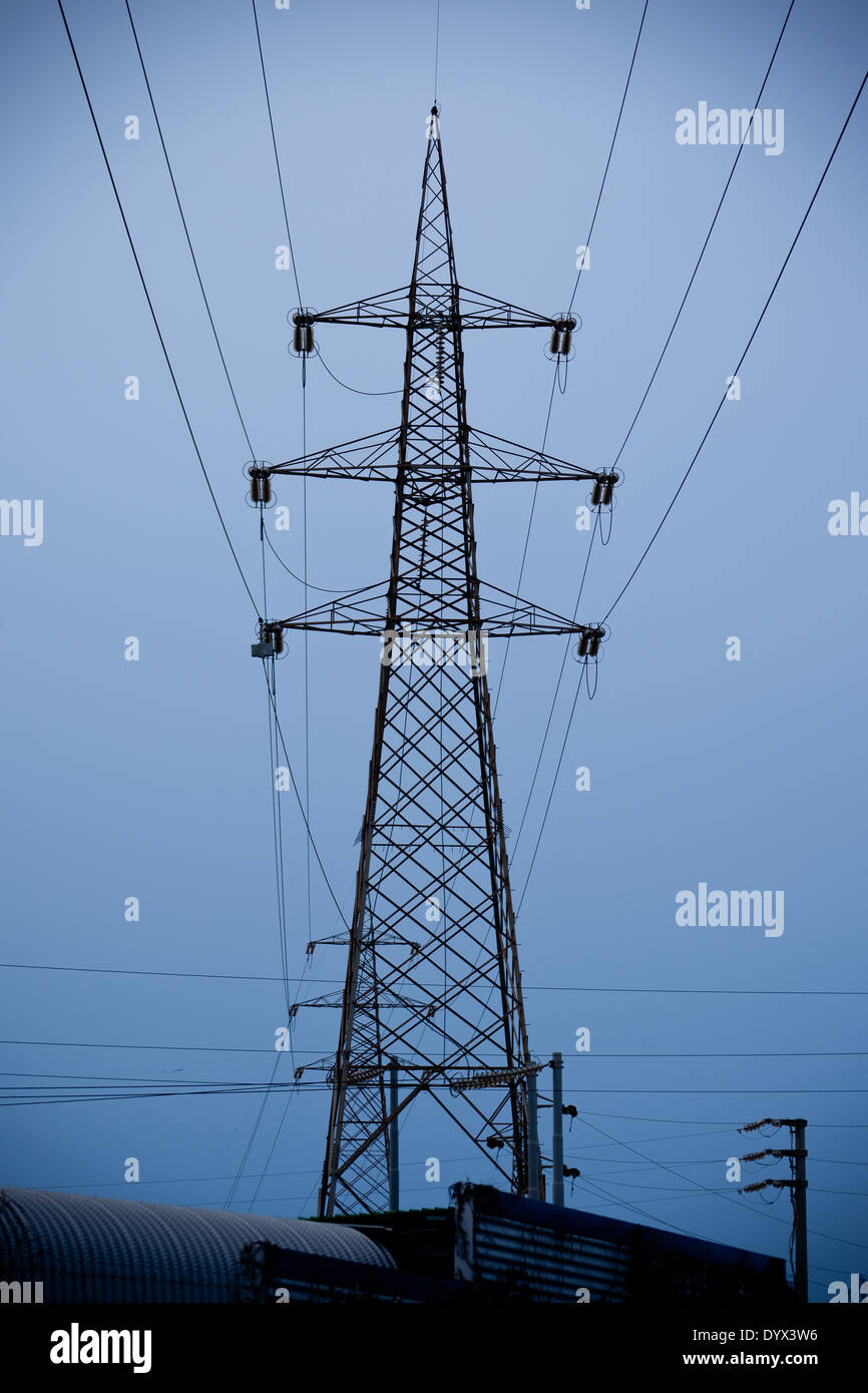 Electrical Pylon with dark sky Stock Photo