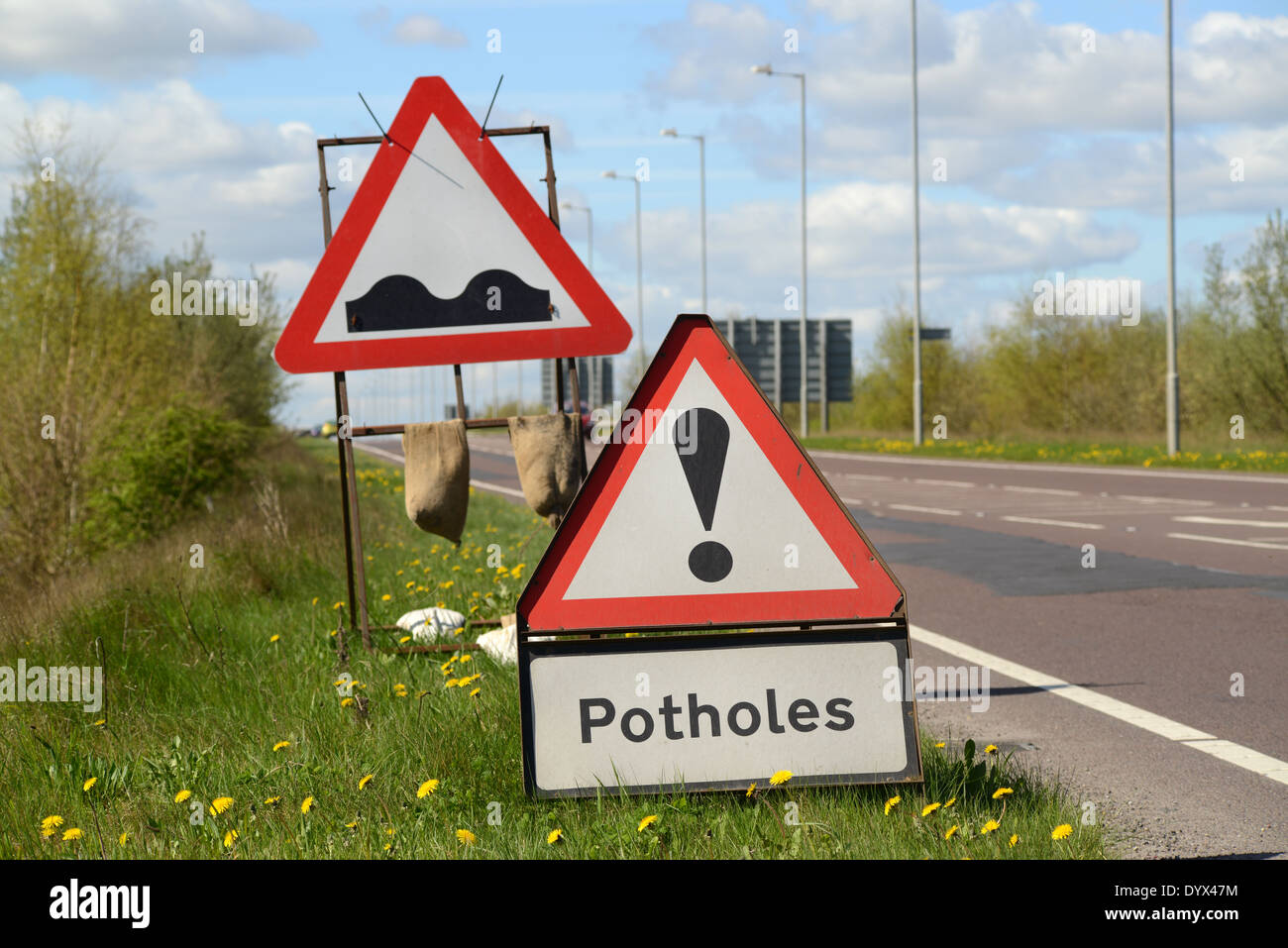 sign warning of pothole in road united kingdom Stock Photo - Alamy