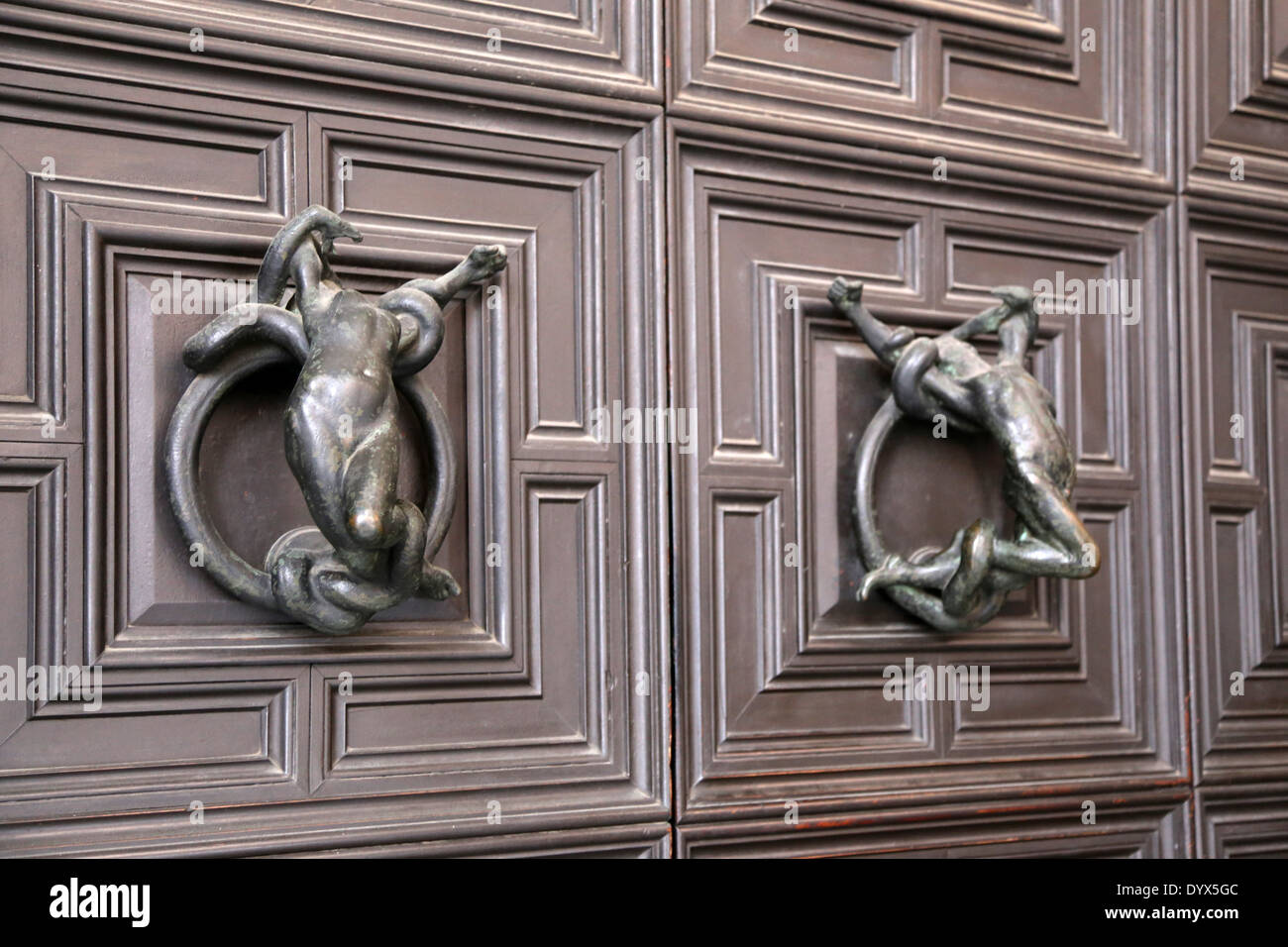 Door knob with female and male figures Stock Photo