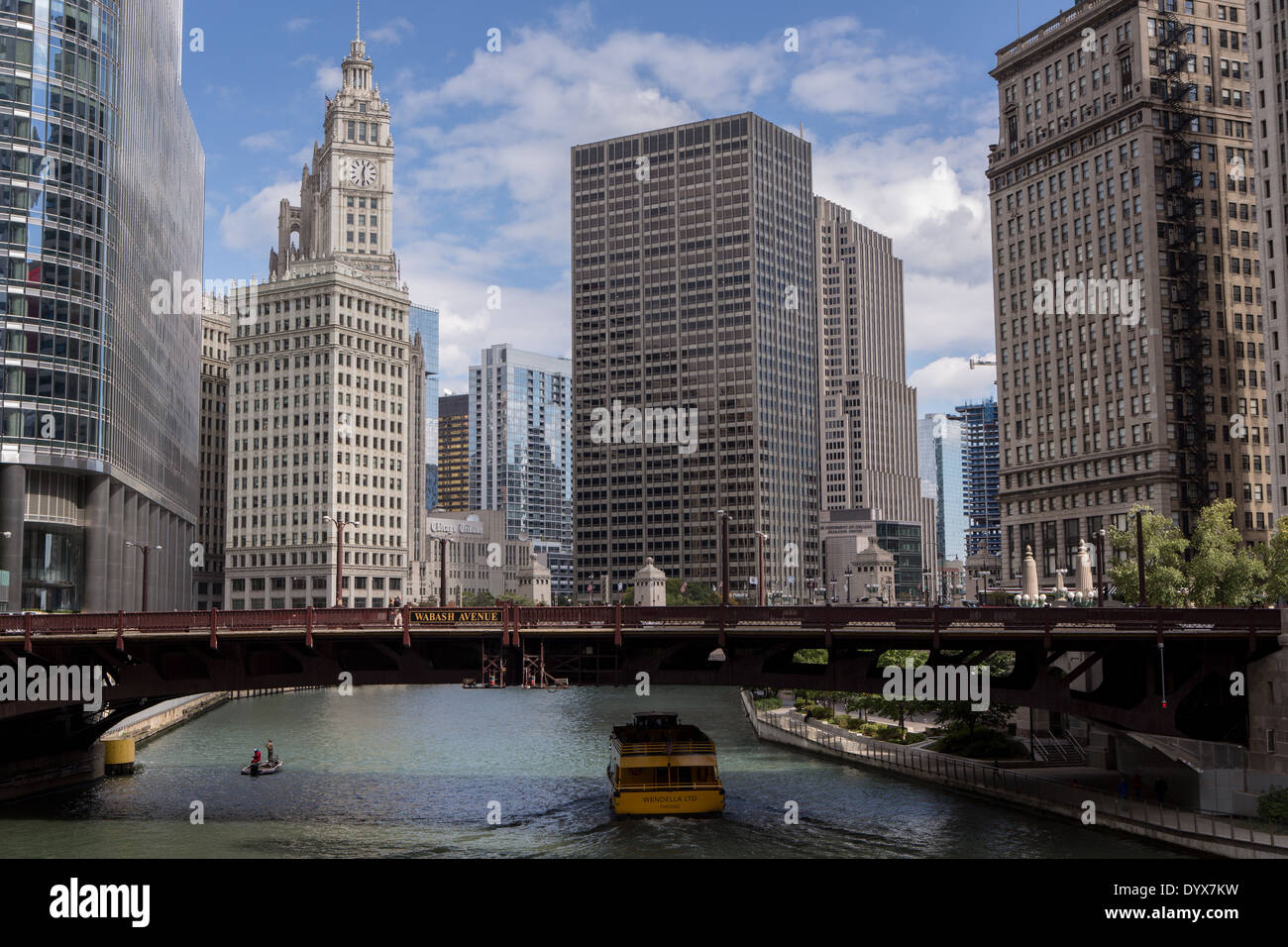 A water taxi travels the Chicago River by Wabash Ave in Chicago, IL. Stock Photo