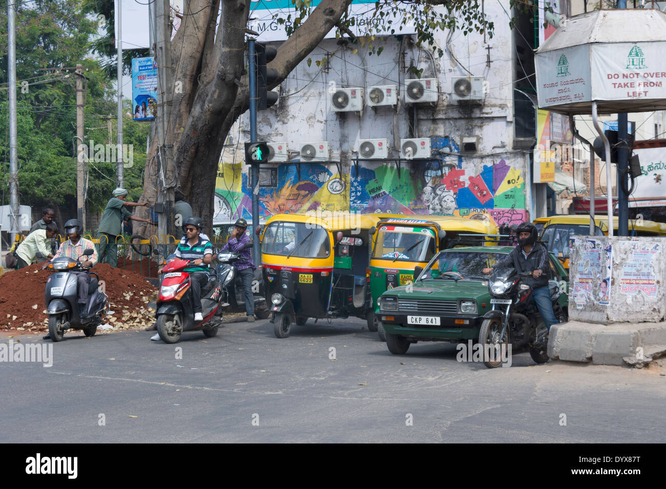 A street scene showing people and traffic in Bangalore, Karnataka, India Stock Photo