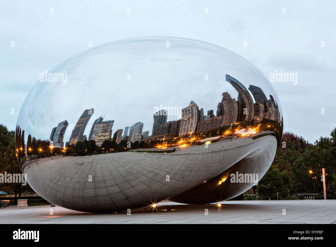 Cloud Gate Sculpture or The Bean with downtown skyline reflected in ...