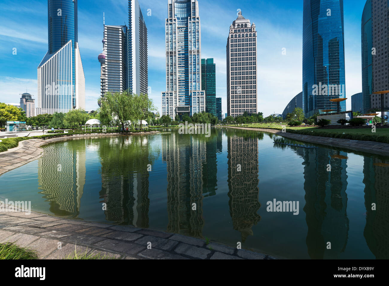 park and skyscrapers under the blue sky in shanghai Stock Photo