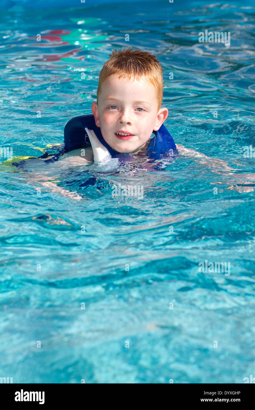 Young Boys playing in the swimming pool Stock Photo