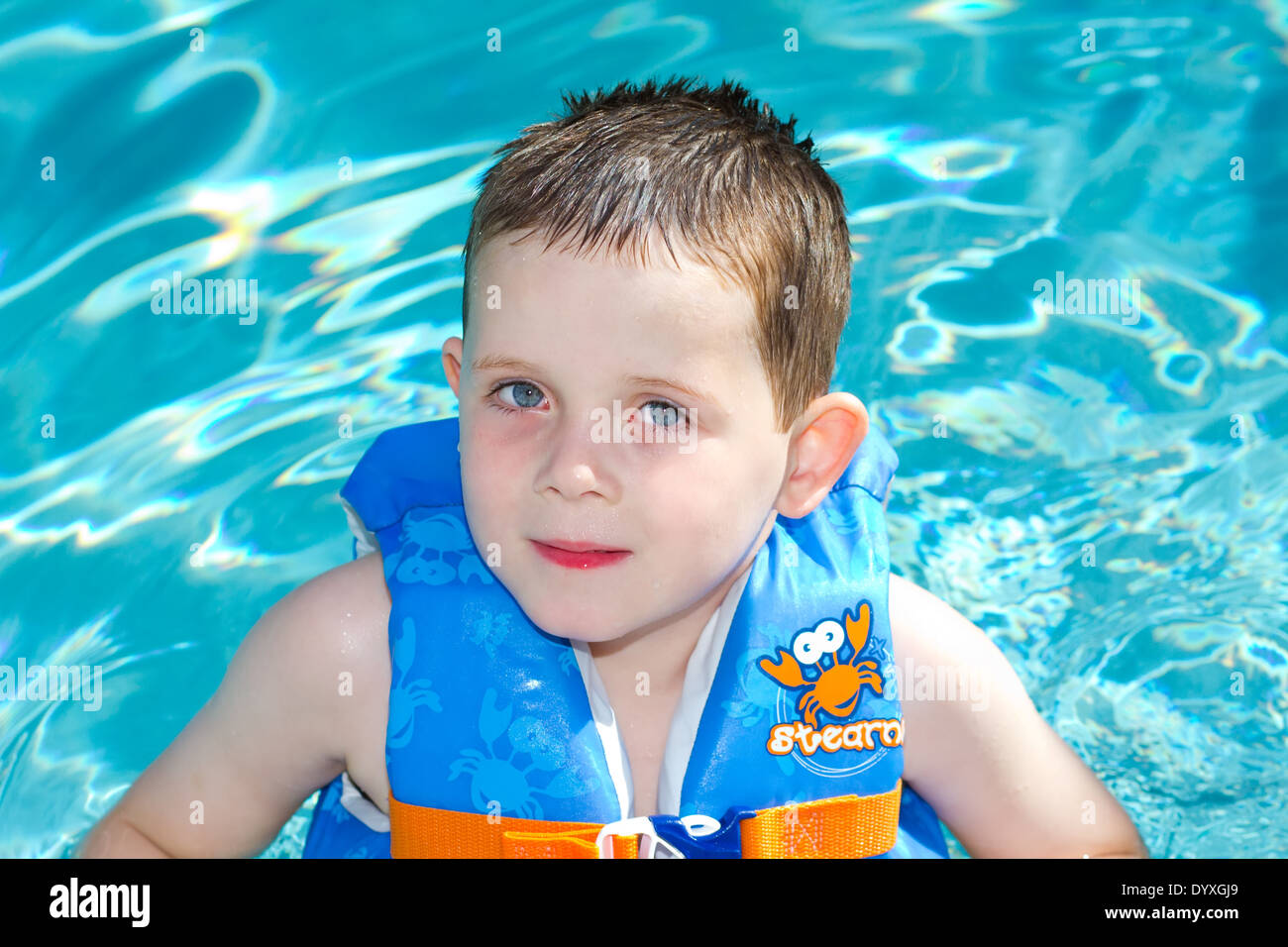 Young Boys playing in the swimming pool Stock Photo Alamy