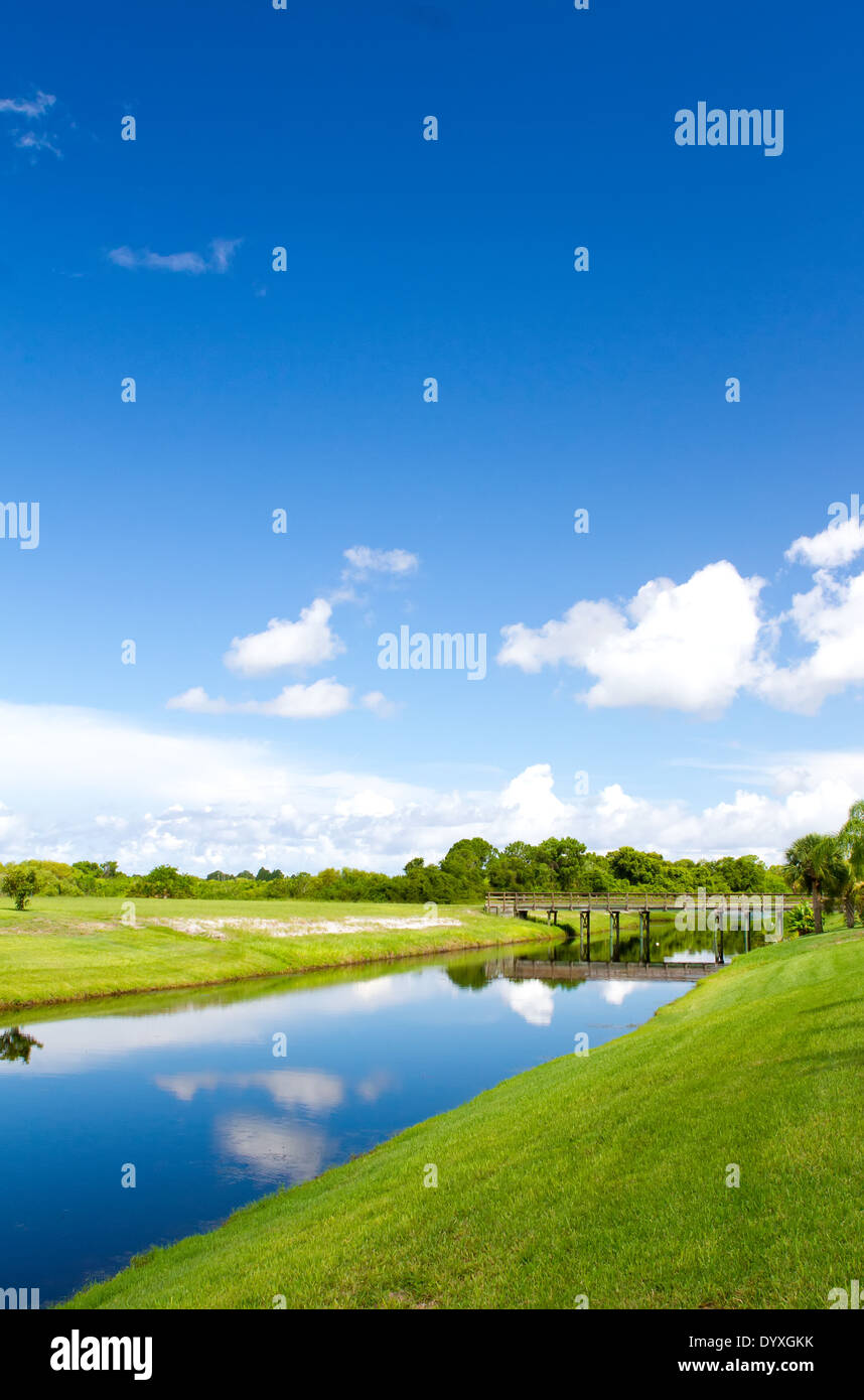 Freshwater canal at the rear of residential homes in Rotonda, Florida on a bright sunny day Stock Photo
