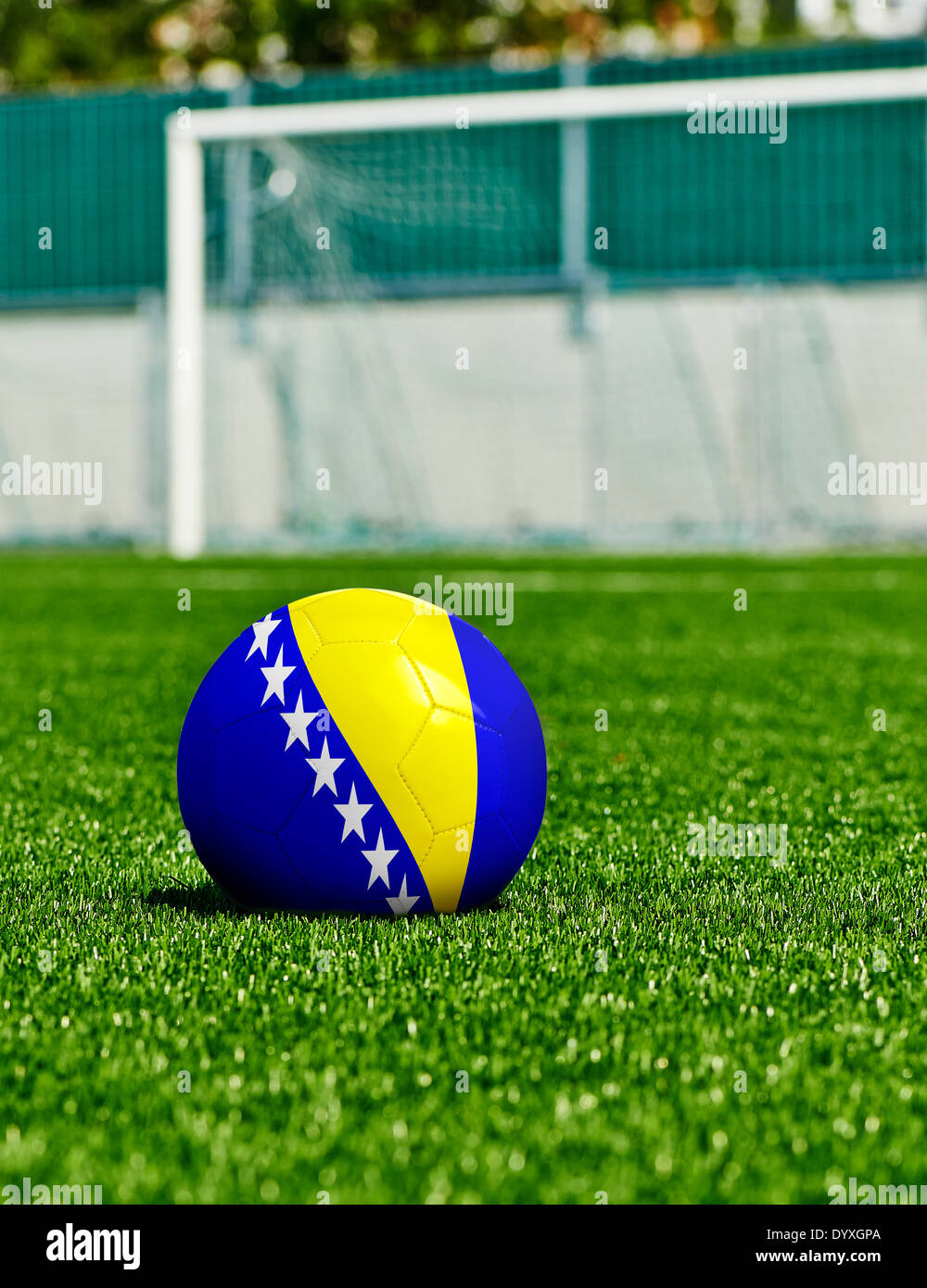 Soccer Ball with Bosnia and Herzegovina Flag on the grass in stadium Stock Photo