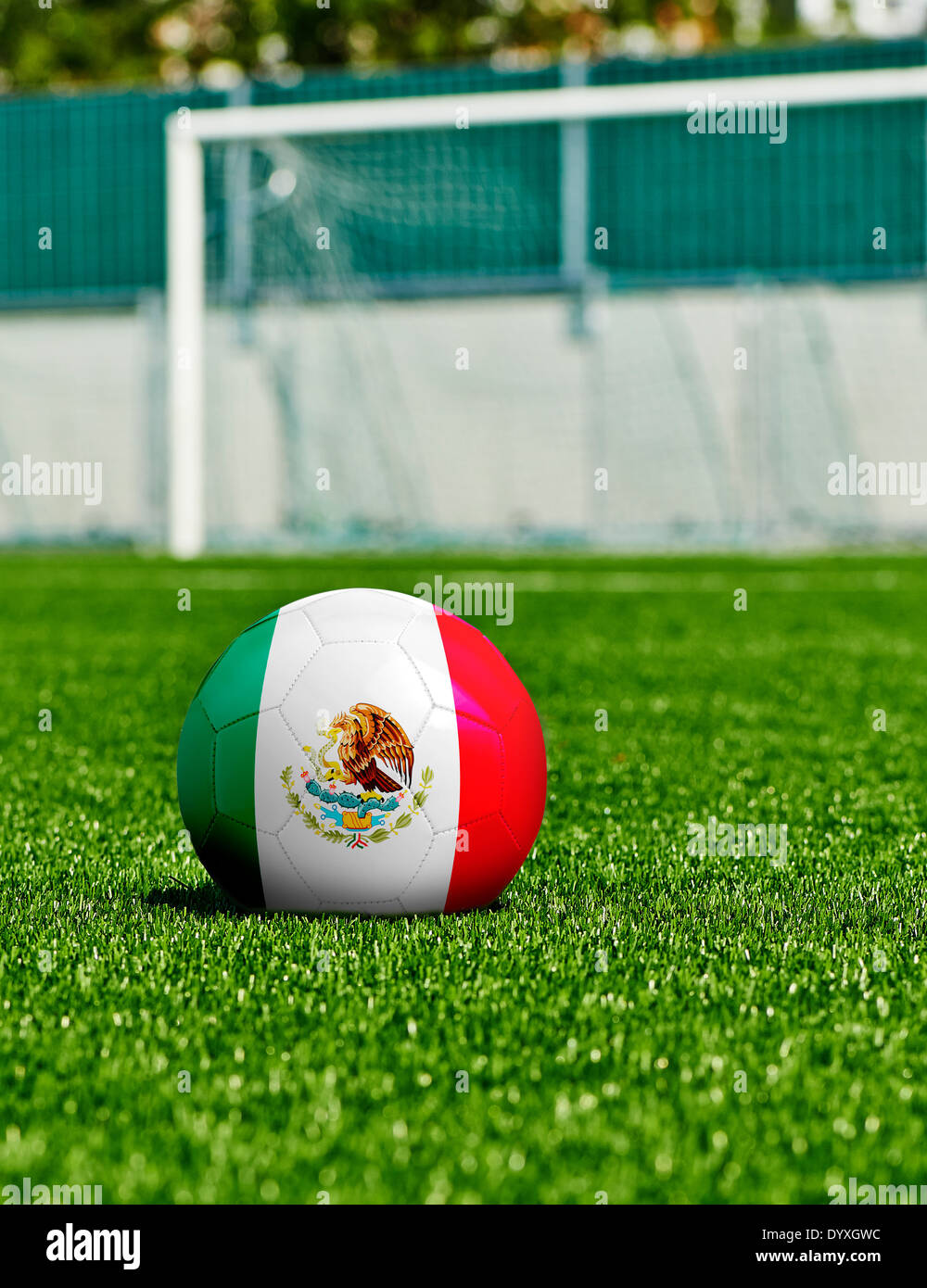 Soccer Ball with Mexico Flag on the grass in stadium Stock Photo