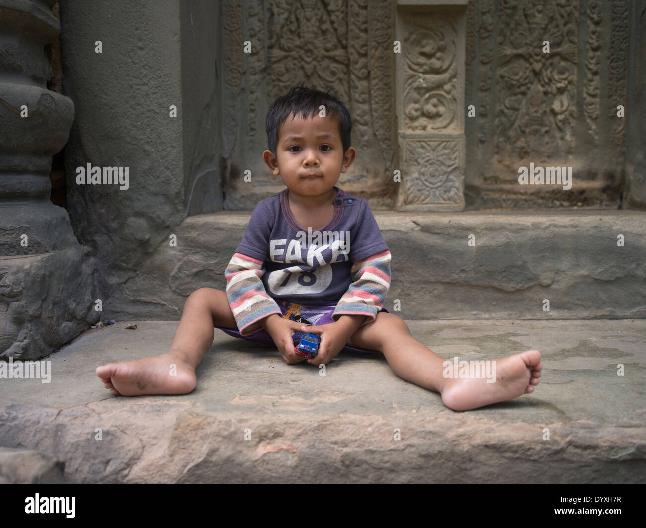 Young Cambodian boy at Preah Ko Temple ( Roluos Group ) , Siem Reap, Cambodia Stock Photo