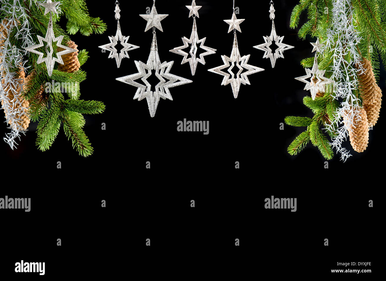 christmas tree with shiny silver stars on black background. christmas decoration Stock Photo