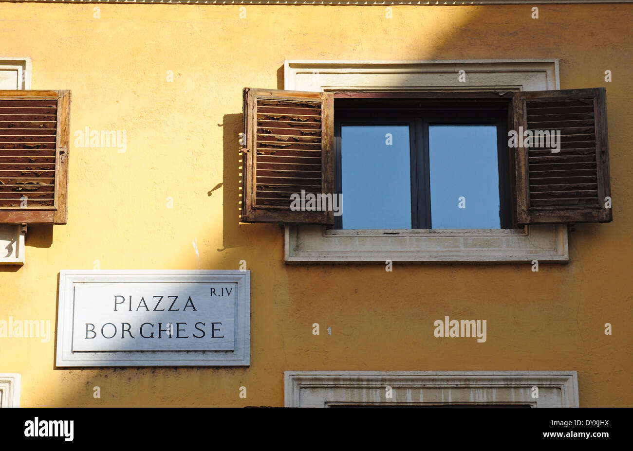 Wall sign and window, Piazza Borghese, Rome, Italy Stock Photo